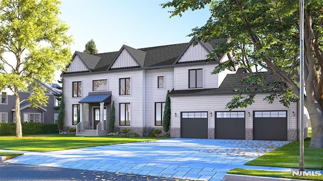 view of front facade featuring a garage and a front lawn