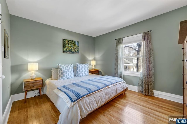 bedroom with light wood-type flooring