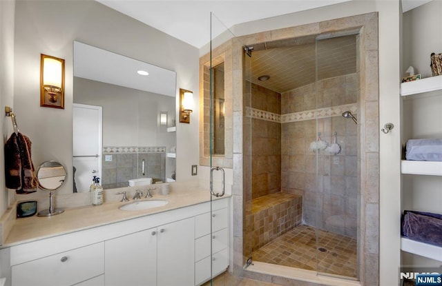 bathroom with vanity and an enclosed shower