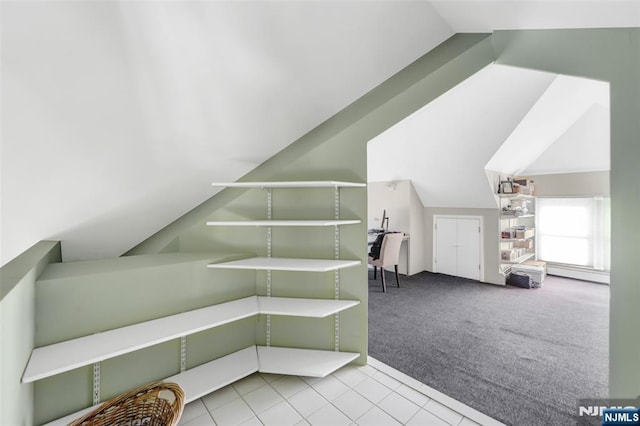 bonus room with light colored carpet, lofted ceiling, and a baseboard heating unit