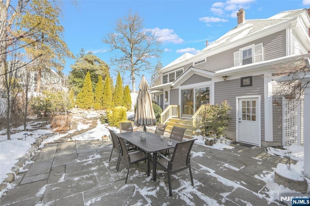 view of snow covered patio