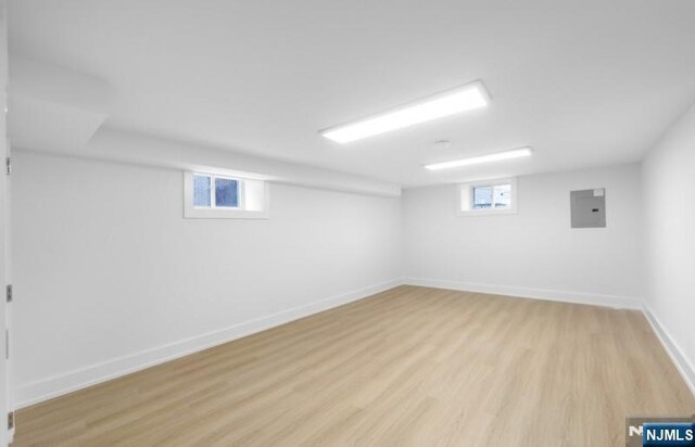 23 Roma St, Nutley, NJ 07110 - below grade area with light wood-style flooring, electric panel, and baseboards