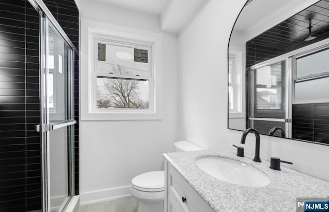 23 Roma St, Nutley, NJ 07110 - bathroom with a shower stall, vanity, plenty of natural light, and toilet