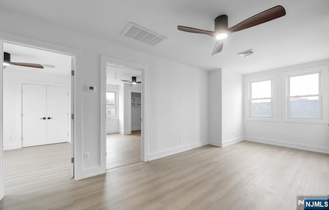 23 Roma St, Nutley, NJ 07110 - unfurnished room featuring visible vents, light wood-type flooring, and a ceiling fan