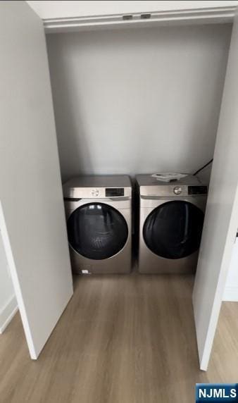 23 Roma St, Nutley, NJ 07110 - laundry room with washer and dryer and wood finished floors