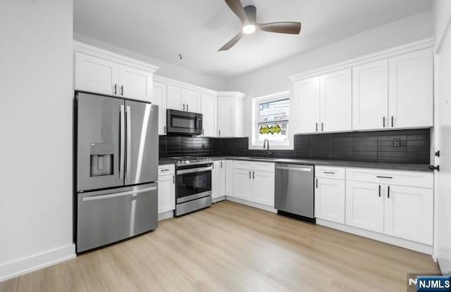 23 Roma St, Nutley, NJ 07110 - kitchen with stainless steel appliances, ceiling fan, a sink, and dark countertops