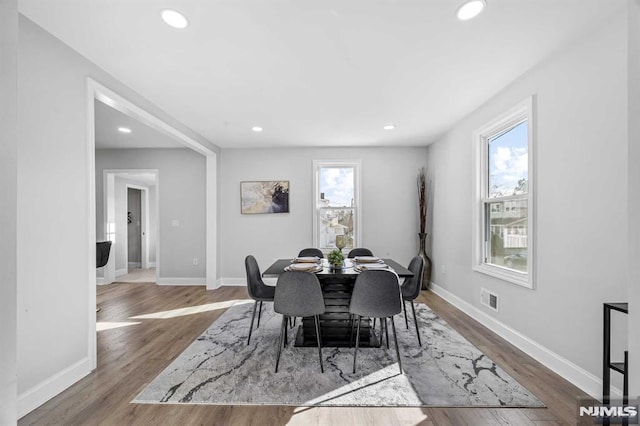 dining area with hardwood / wood-style flooring