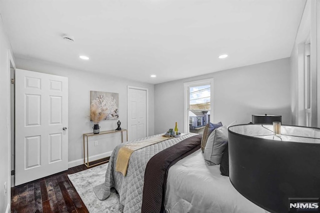 bedroom with dark hardwood / wood-style flooring