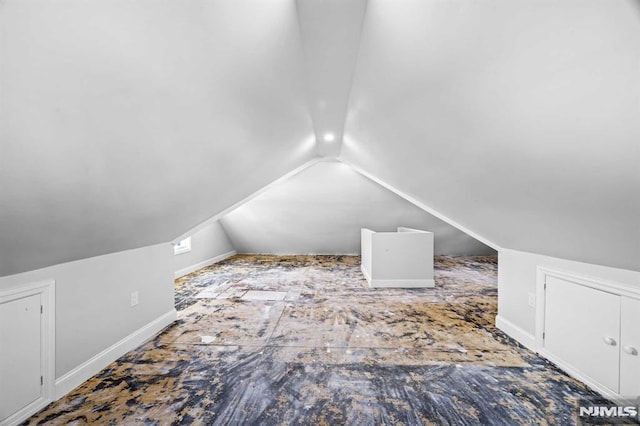 bonus room featuring vaulted ceiling