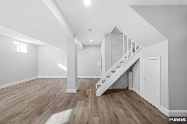 basement with wood-type flooring