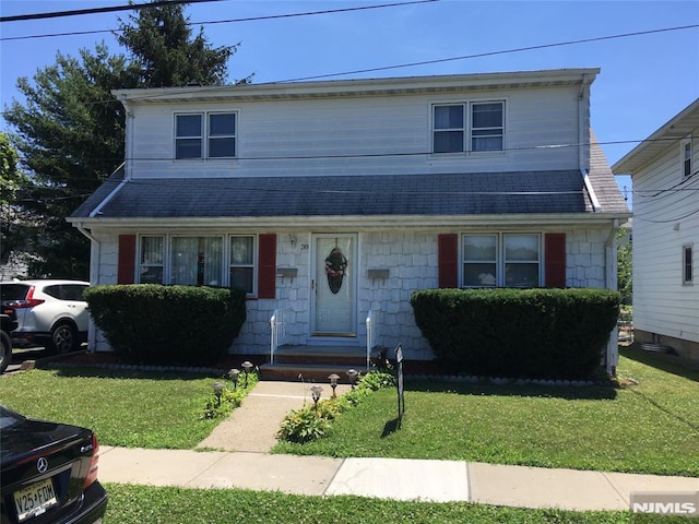 view of property featuring a front yard