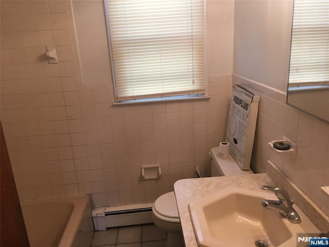 bathroom featuring a baseboard radiator, sink, tile walls, tile patterned flooring, and toilet