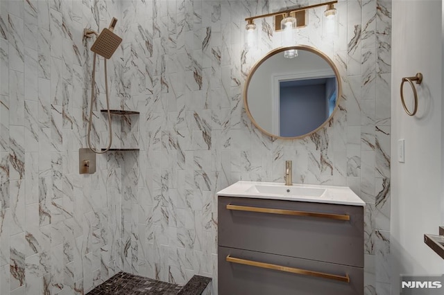 bathroom with vanity and a shower