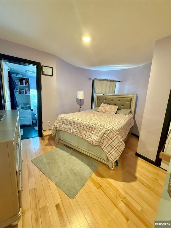 bedroom featuring light hardwood / wood-style floors