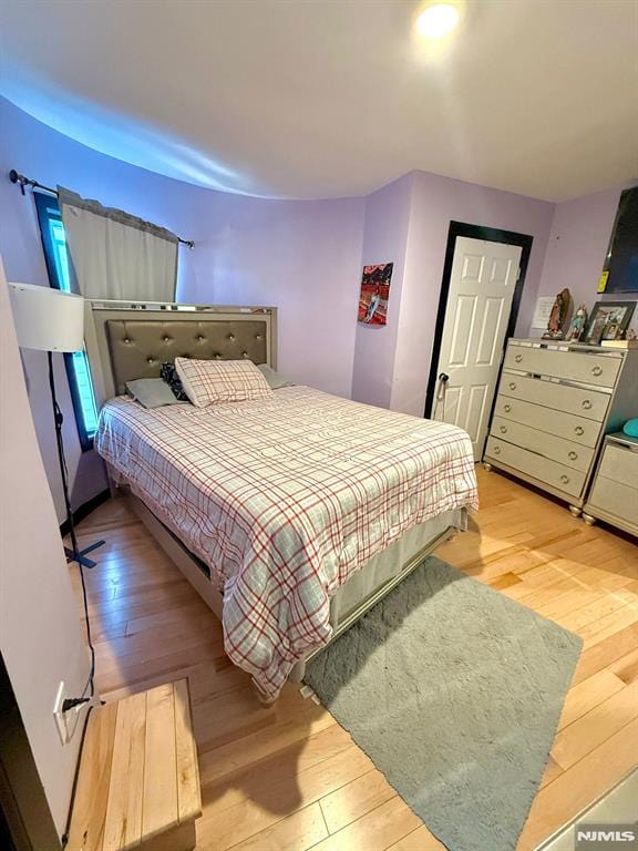 bedroom featuring light hardwood / wood-style floors