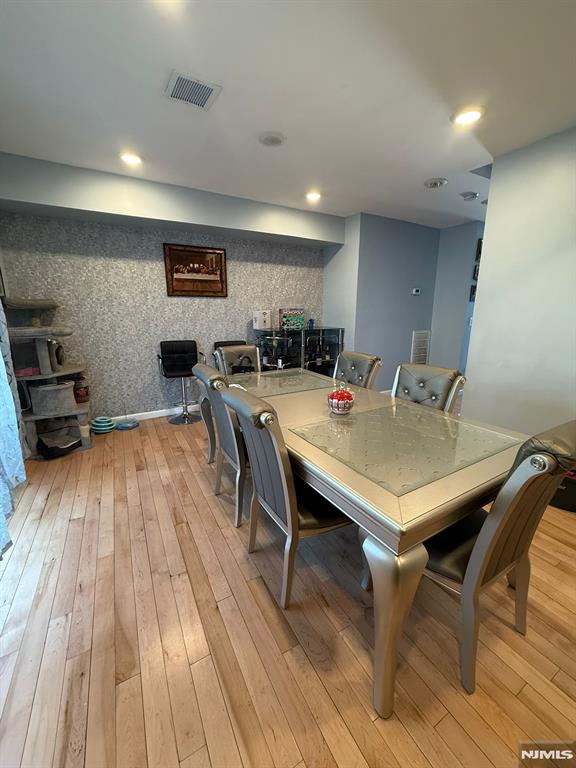 dining area with light hardwood / wood-style floors