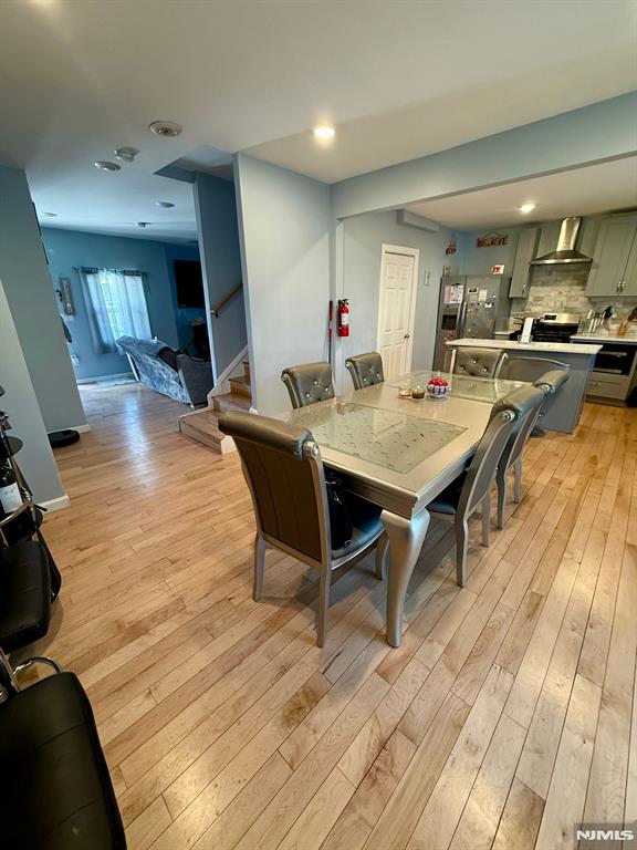 dining space with light wood-type flooring