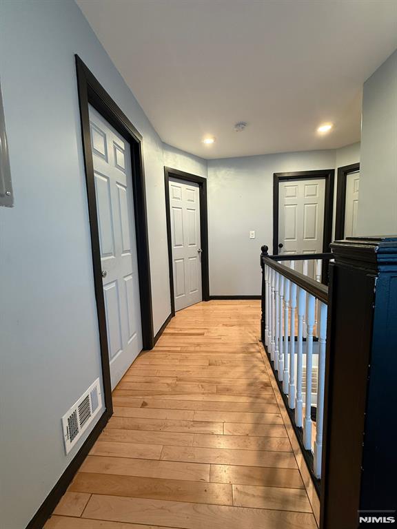 hallway featuring light hardwood / wood-style flooring