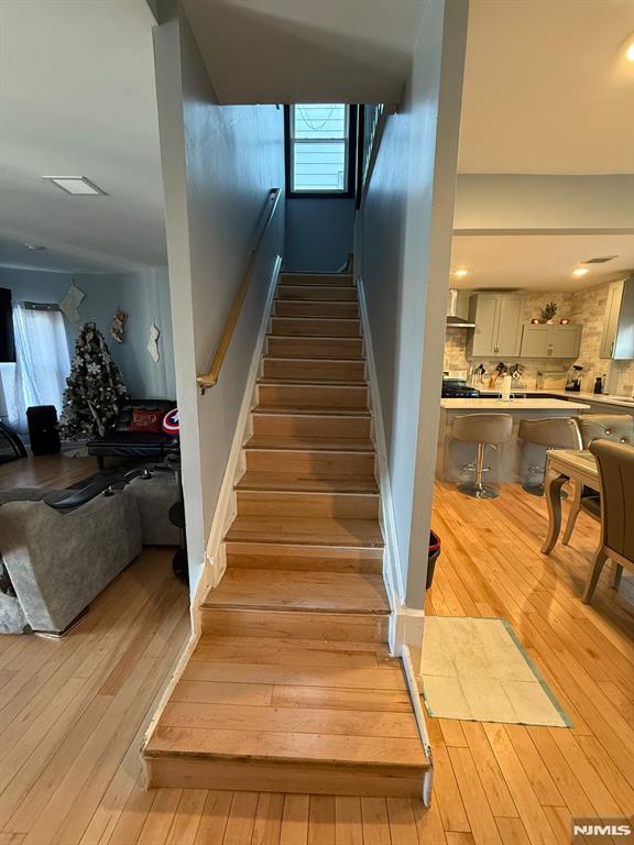 staircase featuring hardwood / wood-style flooring