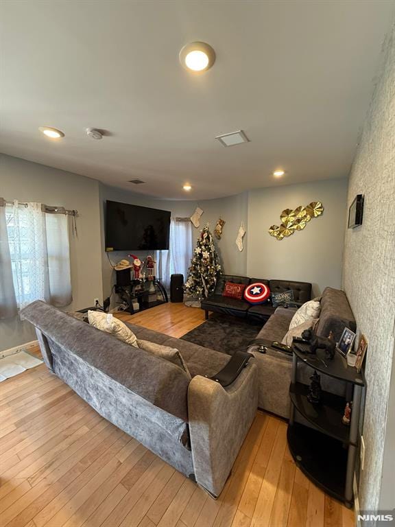 living room with light hardwood / wood-style floors