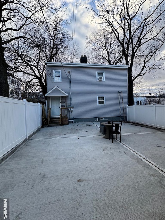 rear view of property featuring a patio