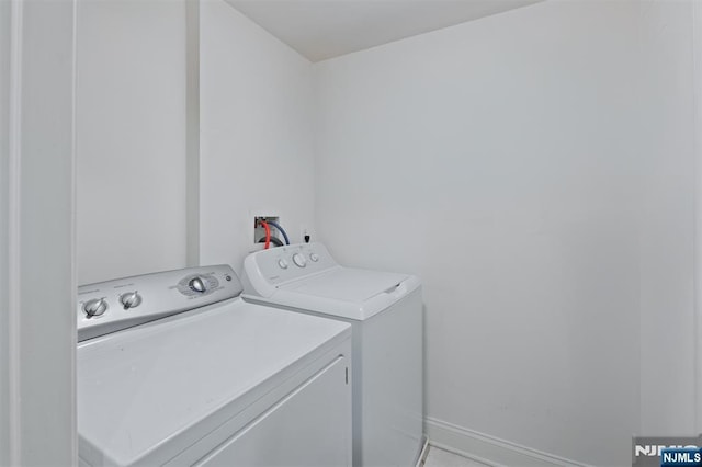 laundry area with washing machine and dryer