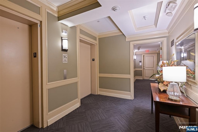 corridor featuring crown molding, dark carpet, and elevator