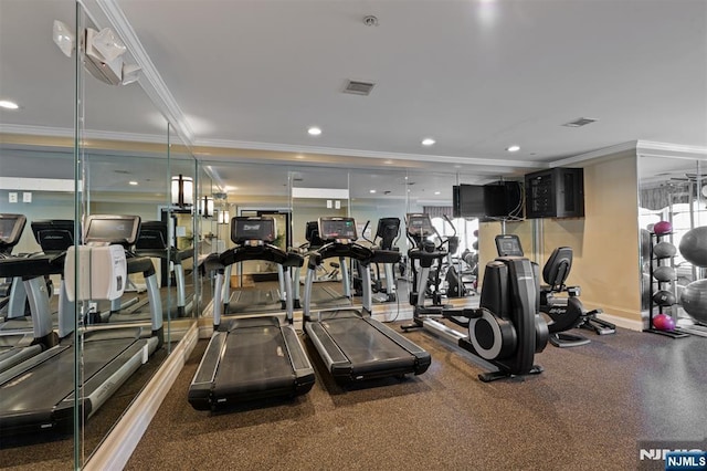 workout area featuring ornamental molding