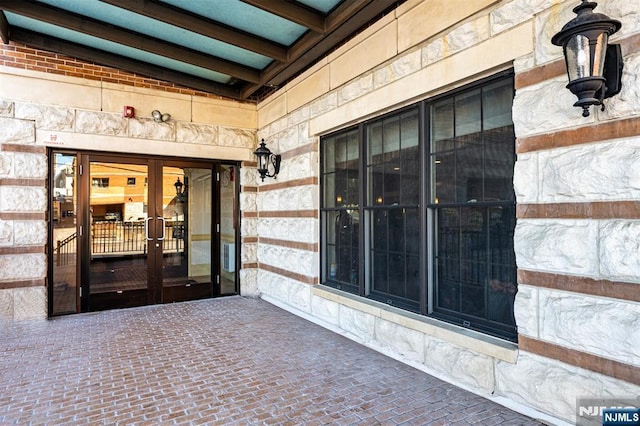 entrance to property featuring french doors