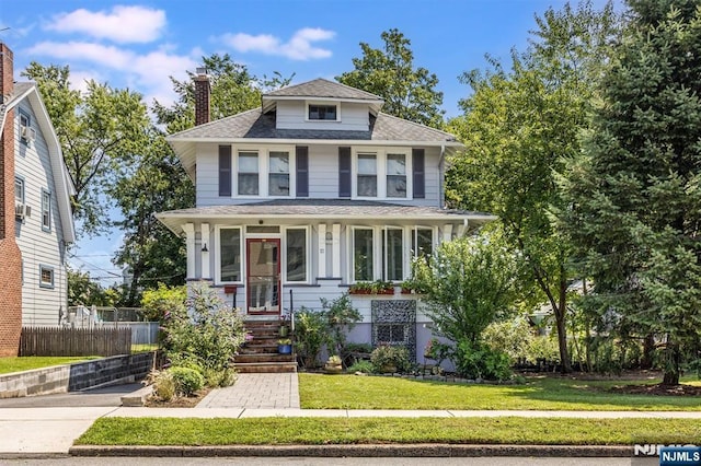 view of front of home with a front yard