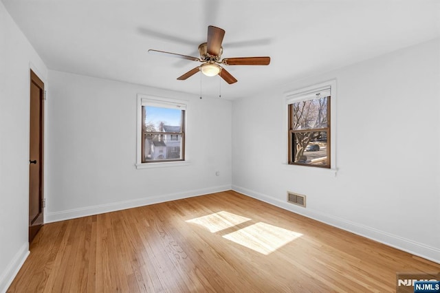 unfurnished room featuring ceiling fan and light hardwood / wood-style floors