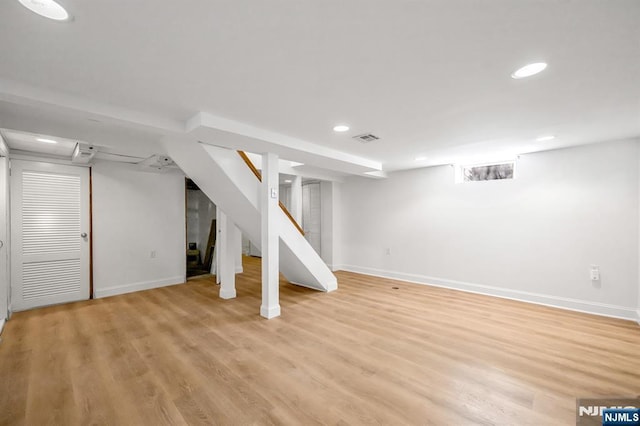 basement featuring light hardwood / wood-style flooring