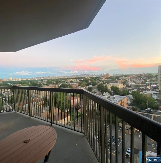 view of balcony at dusk