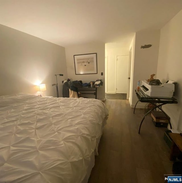 bedroom with wood-type flooring