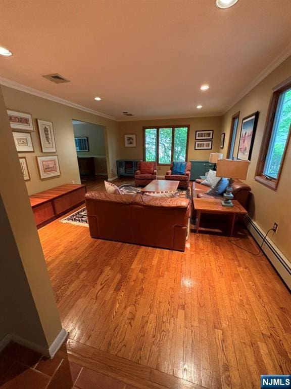 103 Northwood Ave, Demarest, NJ 07627 - living room with light wood-type flooring, healthy amount of natural light, crown molding, recessed lighting, and baseboard heating