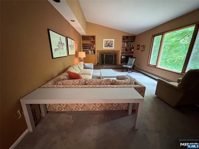 103 Northwood Ave, Demarest, NJ 07627 - carpeted living room with vaulted ceiling, baseboard heating, built in features, a fireplace with raised hearth, and baseboards