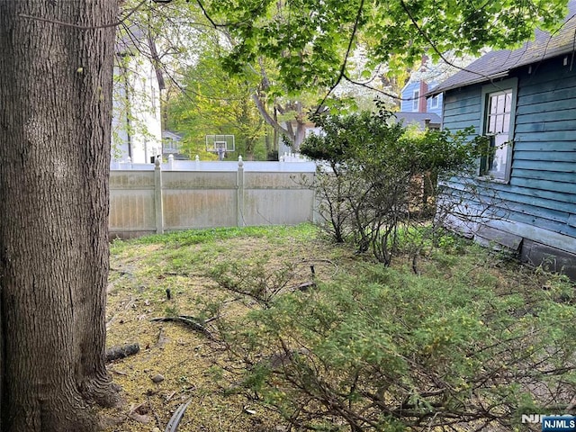 view of yard featuring fence