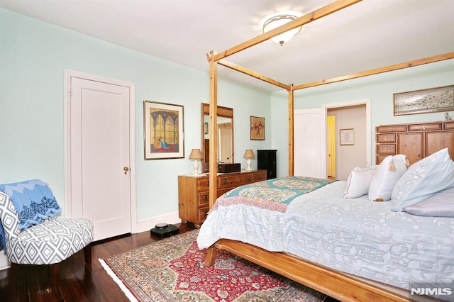 bedroom featuring dark wood-type flooring