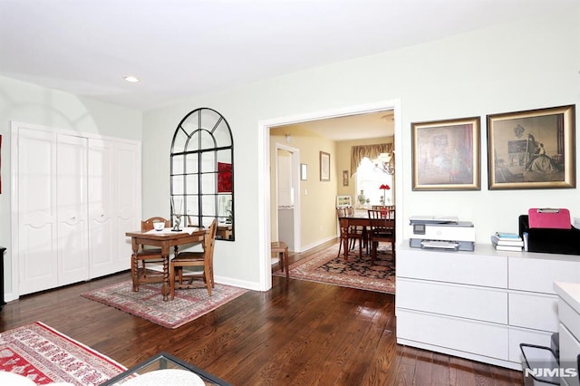 home office with dark wood-type flooring