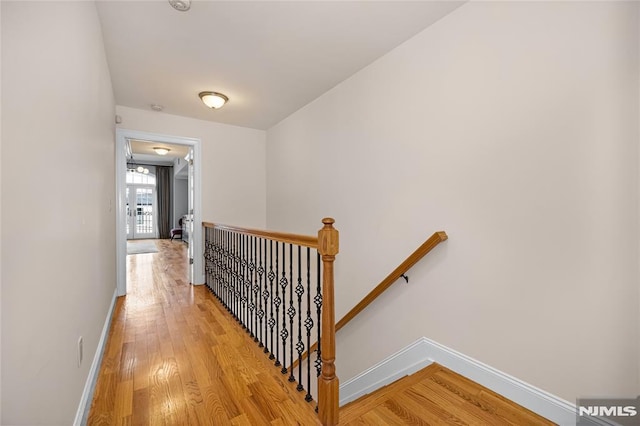 corridor featuring light hardwood / wood-style floors