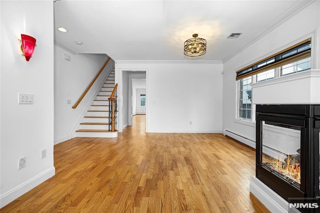 unfurnished living room with crown molding, a baseboard radiator, light hardwood / wood-style floors, and a multi sided fireplace