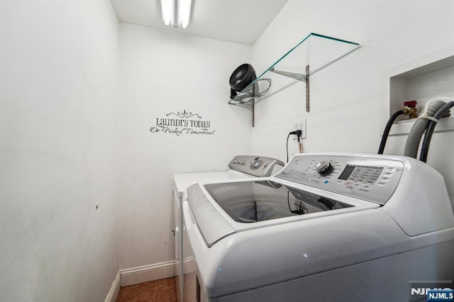 laundry room with independent washer and dryer