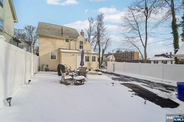 view of snow covered house