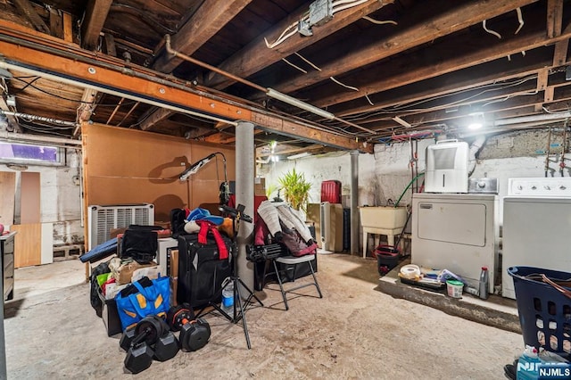 basement featuring sink and washer and clothes dryer