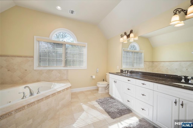 full bath with lofted ceiling, toilet, a sink, and visible vents