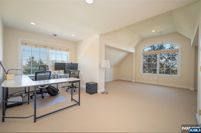 carpeted office space featuring lofted ceiling, visible vents, baseboards, and recessed lighting