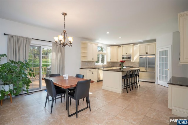 dining area featuring recessed lighting, visible vents, and a notable chandelier