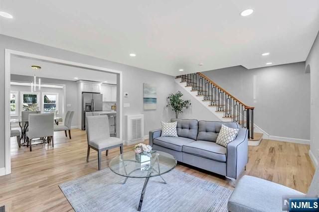 living room with light hardwood / wood-style floors