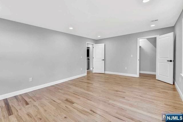 unfurnished bedroom with light hardwood / wood-style floors