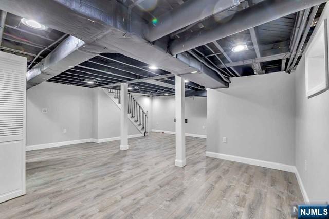 basement with wood-type flooring